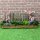 Kleiner Gartenzaun mit Blumenbeet